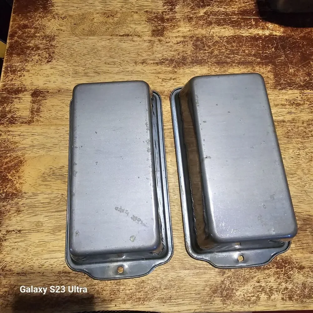 Two metal loaf pans